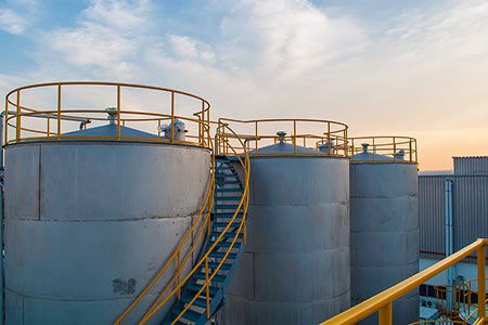 Oil rises on back of production cuts, falling crude inventories
